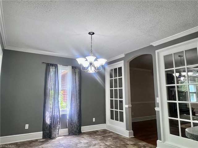 5608 Fred Lineberry Rd, Randleman, NC 27317 - empty room with arched walkways, a chandelier, plenty of natural light, ornamental molding, and a textured ceiling
