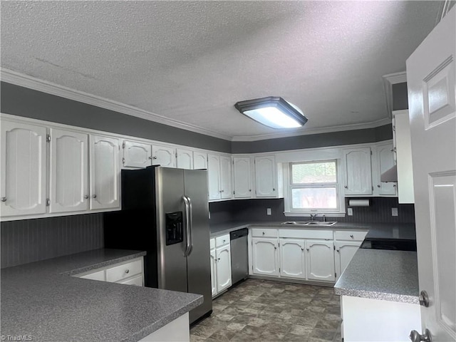 5608 Fred Lineberry Rd, Randleman, NC 27317 - kitchen with a sink, stainless steel appliances, white cabinets, crown molding, and a textured ceiling