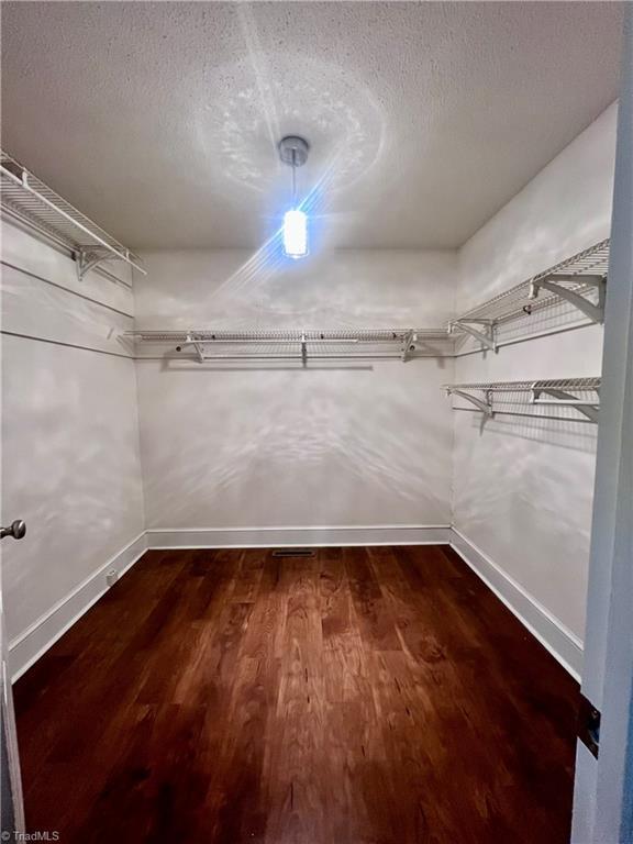 5608 Fred Lineberry Rd, Randleman, NC 27317 - walk in closet featuring dark wood-type flooring
