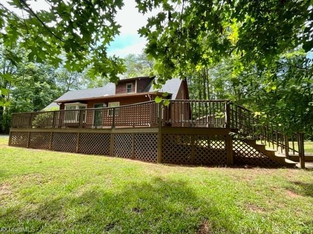 5608 Fred Lineberry Rd, Randleman, NC 27317 - rear view of house featuring a yard and a deck