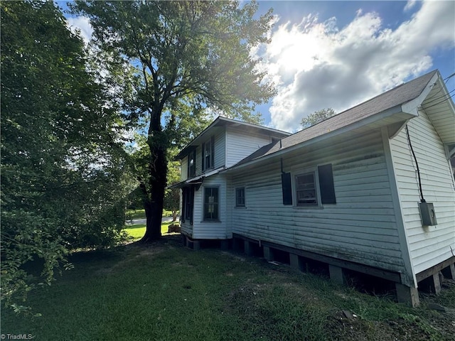 view of property exterior featuring a yard