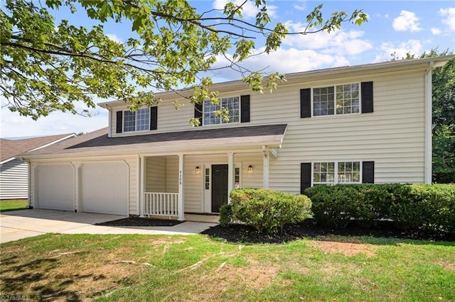 view of front of house featuring a porch, a garage, and a front lawn