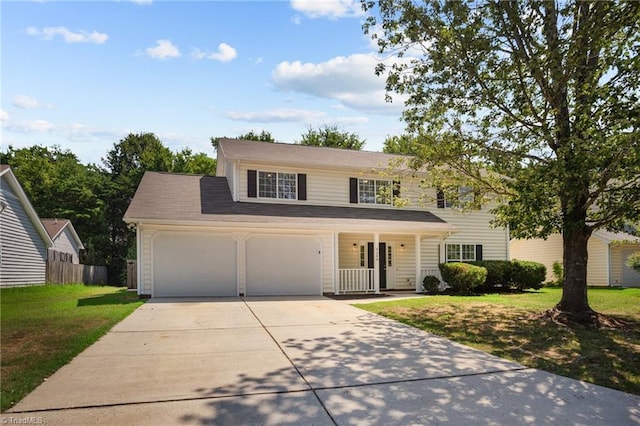 view of front of home featuring a garage, a porch, and a front yard