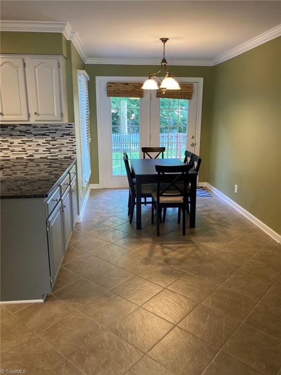 3908 Sandlewood Rd, High Point, NC 27265 - tiled dining space with ornamental molding and a chandelier