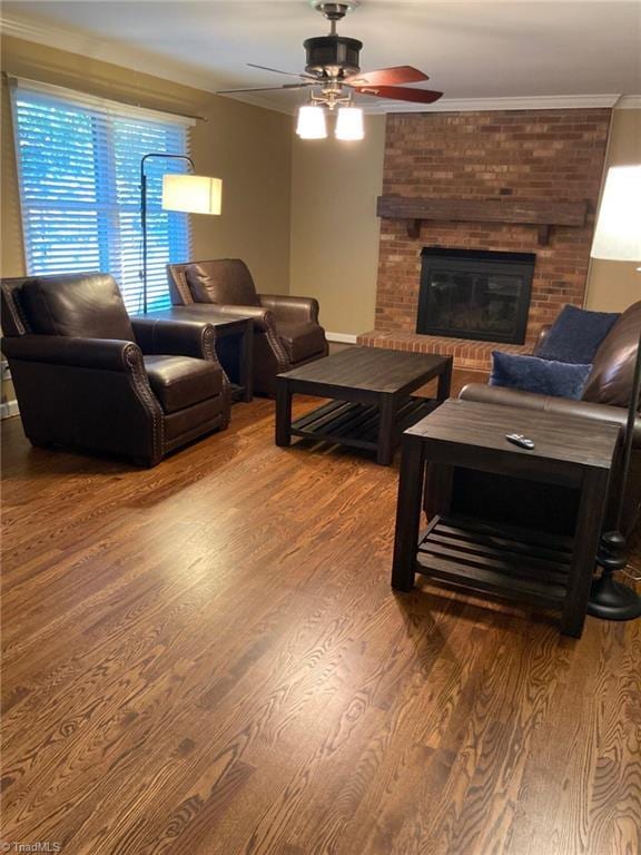 3908 Sandlewood Rd, High Point, NC 27265 - living room featuring ceiling fan, ornamental molding, wood finished floors, and a brick fireplace