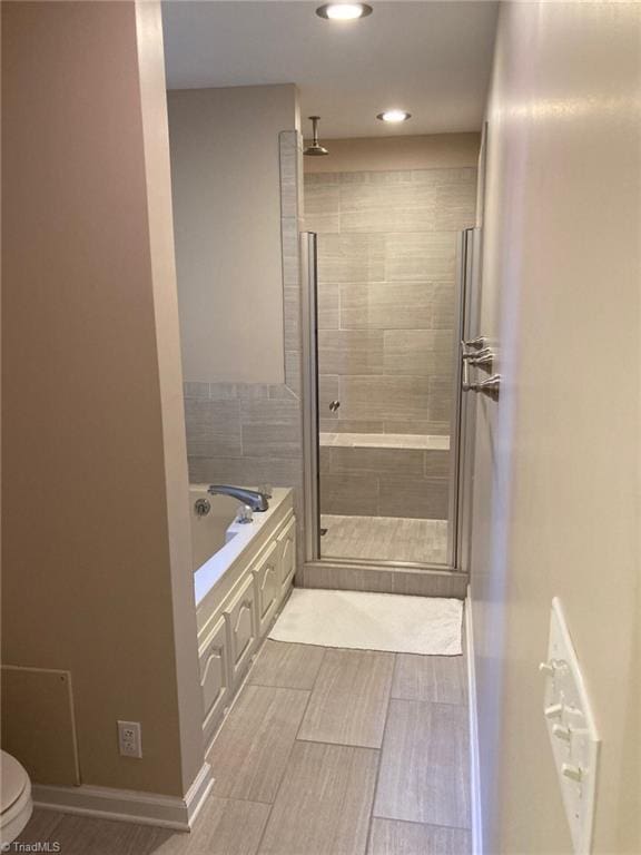 3908 Sandlewood Rd, High Point, NC 27265 - full bath featuring a stall shower, a bath, and recessed lighting