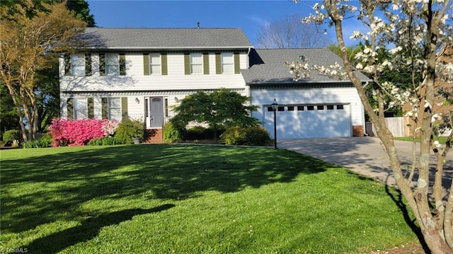 3908 Sandlewood Rd, High Point, NC 27265 - colonial house with driveway, a garage, and a front lawn