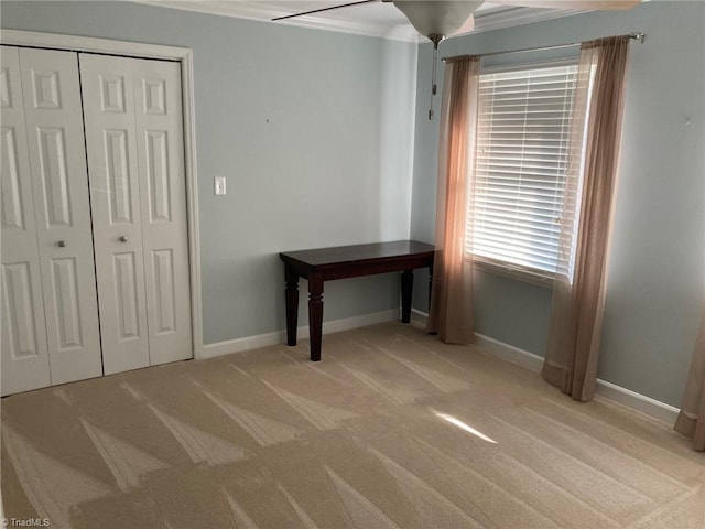 3908 Sandlewood Rd, High Point, NC 27265 - unfurnished bedroom featuring carpet floors, crown molding, and a closet