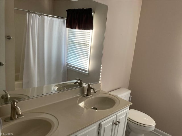 3908 Sandlewood Rd, High Point, NC 27265 - bathroom with toilet and double vanity