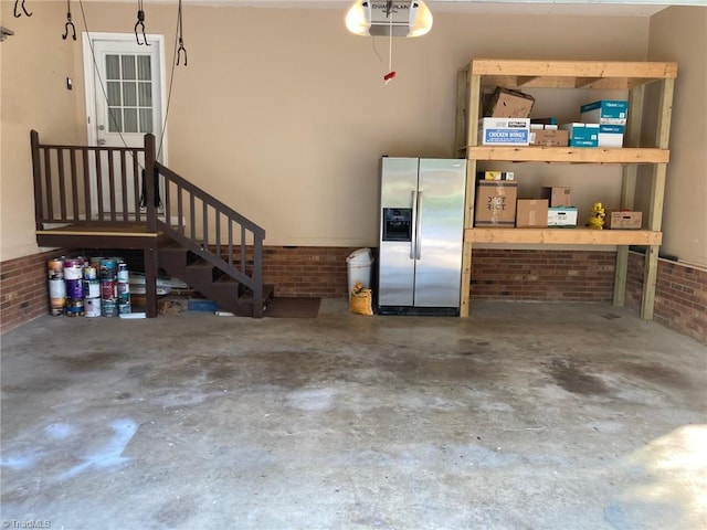 3908 Sandlewood Rd, High Point, NC 27265 - garage featuring stainless steel fridge with ice dispenser and a garage door opener