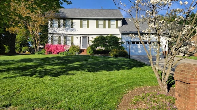 3908 Sandlewood Rd, High Point, NC 27265 - colonial house with concrete driveway, a front lawn, a garage, and roof with shingles