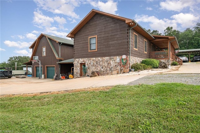 view of property exterior with a yard and a garage