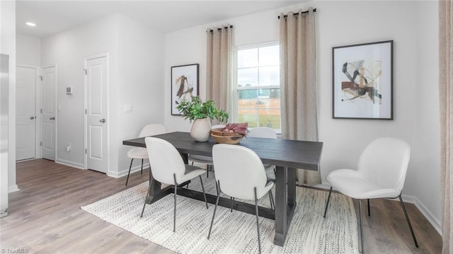 dining space featuring light hardwood / wood-style floors