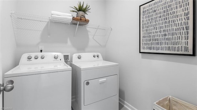 laundry room with independent washer and dryer