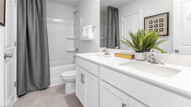 full bathroom featuring toilet, shower / bath combination with curtain, and vanity