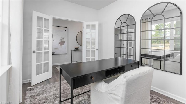 home office featuring french doors and dark wood-type flooring