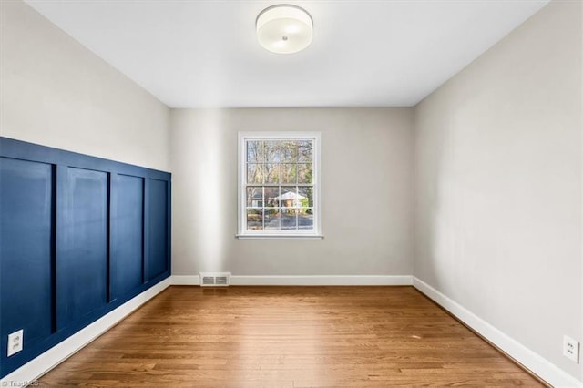 empty room featuring hardwood / wood-style flooring