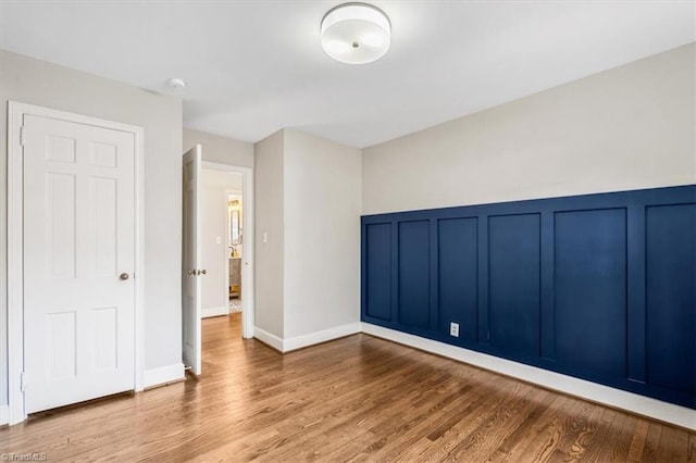 spare room with light hardwood / wood-style floors