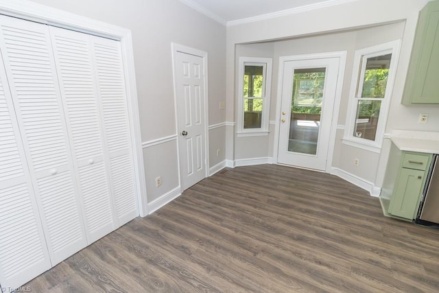 entryway with baseboards, ornamental molding, and dark wood-style flooring