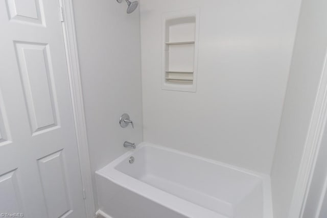 bathroom with shower / washtub combination