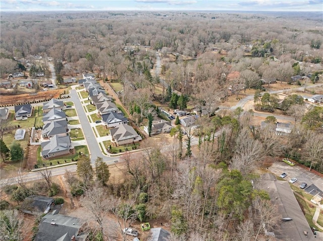 bird's eye view featuring a residential view and a forest view