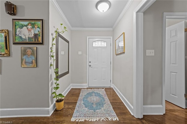 foyer entrance with baseboards, ornamental molding, and wood finished floors