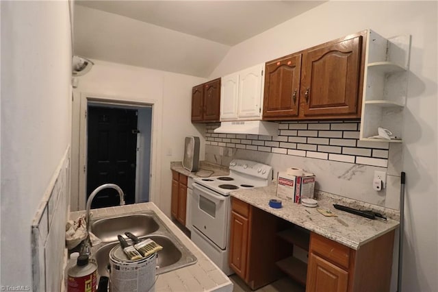 kitchen featuring vaulted ceiling, sink, electric stove, extractor fan, and tasteful backsplash