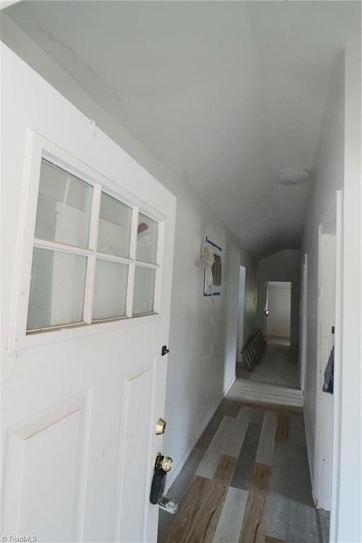 interior space with vaulted ceiling and hardwood / wood-style floors