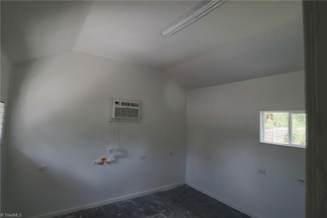 laundry area with a wall unit AC