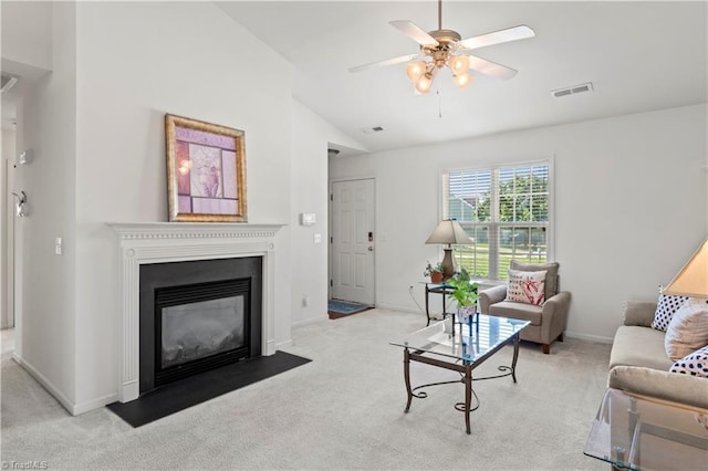3207 Stavanger Ct, Winston-Salem, NC 27127 - carpeted living room with vaulted ceiling, ceiling fan, and a fireplace with flush hearth