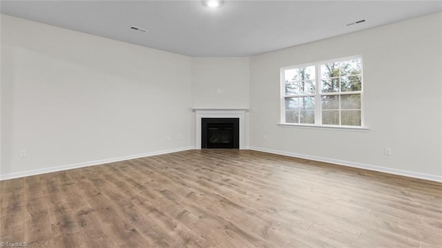 unfurnished living room featuring light wood-type flooring