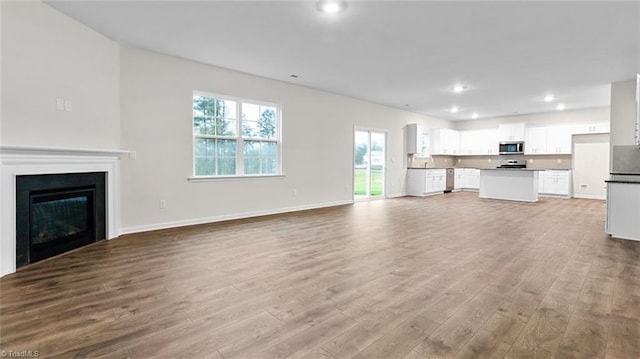 unfurnished living room with light wood-type flooring