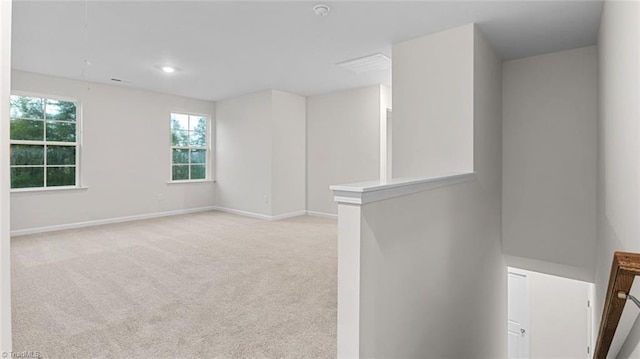 empty room with light colored carpet