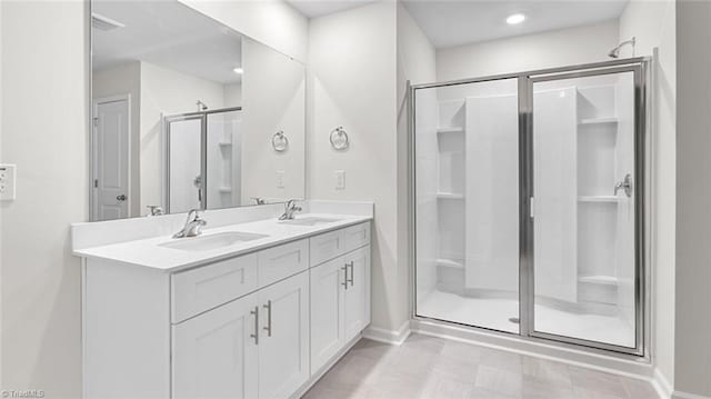 bathroom with vanity and walk in shower