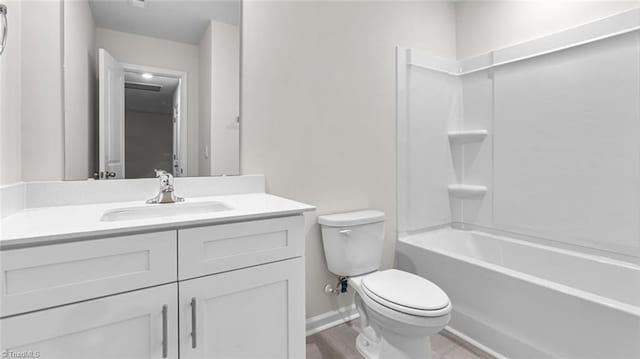 full bathroom featuring vanity, tub / shower combination, and toilet