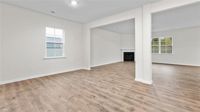 unfurnished living room with light wood-type flooring