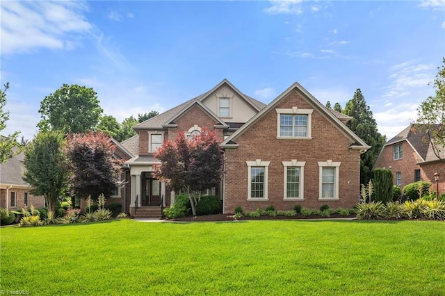 1010 Mill Pointe Way, Elon, NC 27244 - traditional home with a front yard and brick siding