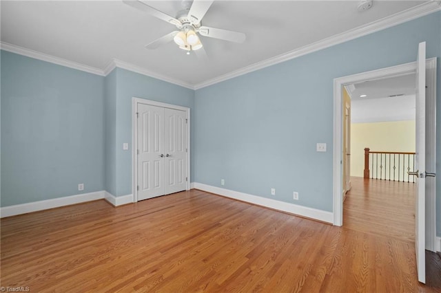 1010 Mill Pointe Way, Elon, NC 27244 - unfurnished bedroom featuring ornamental molding, light wood-style floors, a closet, and a ceiling fan