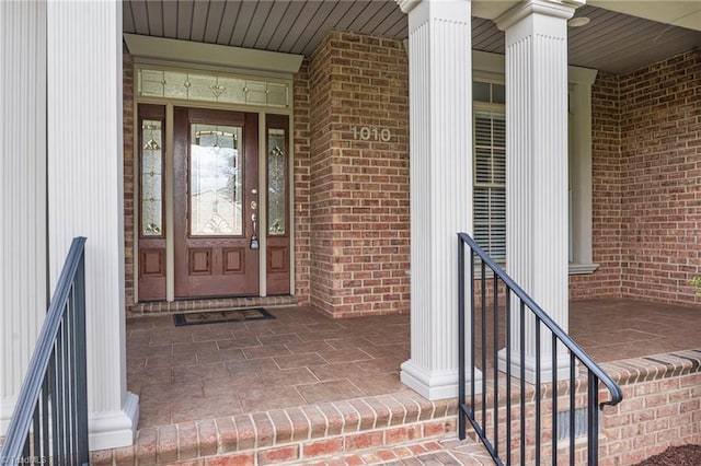 1010 Mill Pointe Way, Elon, NC 27244 - view of exterior entry featuring brick siding and covered porch
