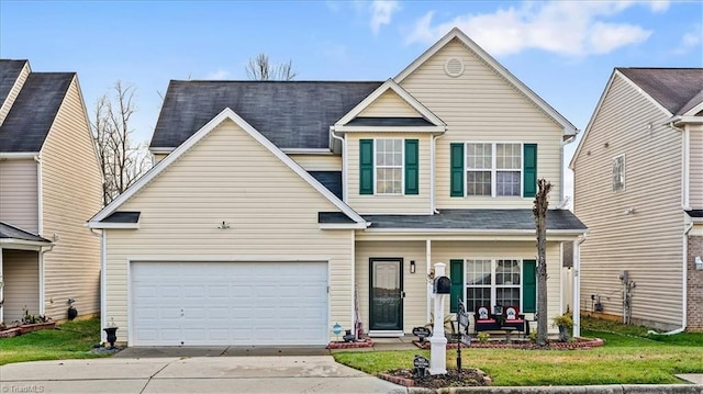 view of front of property with a front lawn, covered porch, and a garage