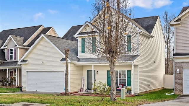 view of front of house featuring a front yard and a garage