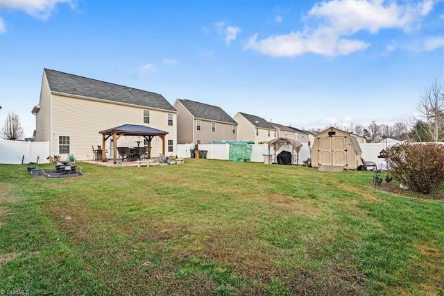 view of yard with a gazebo and a storage shed