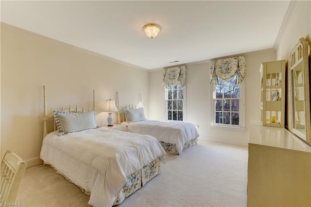 bedroom with baseboards, light carpet, visible vents, and crown molding