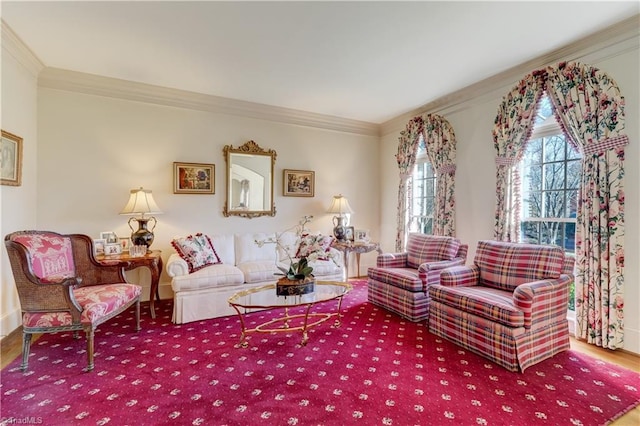 living area with crown molding and wood finished floors