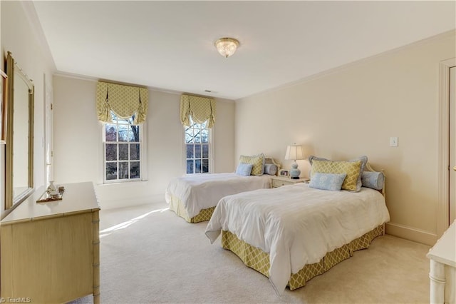 bedroom featuring crown molding, light colored carpet, baseboards, and visible vents