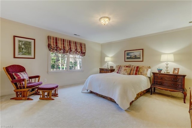 bedroom with visible vents, carpet, and ornamental molding