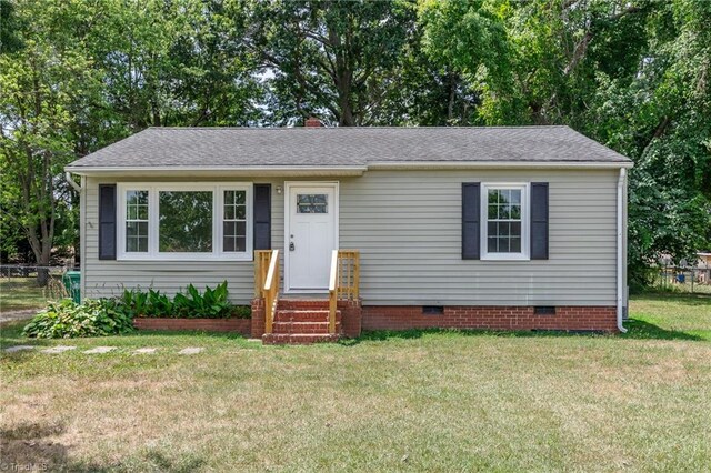 view of front of home with a front lawn