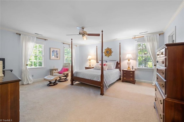 bedroom featuring baseboards, ornamental molding, ceiling fan, and light colored carpet
