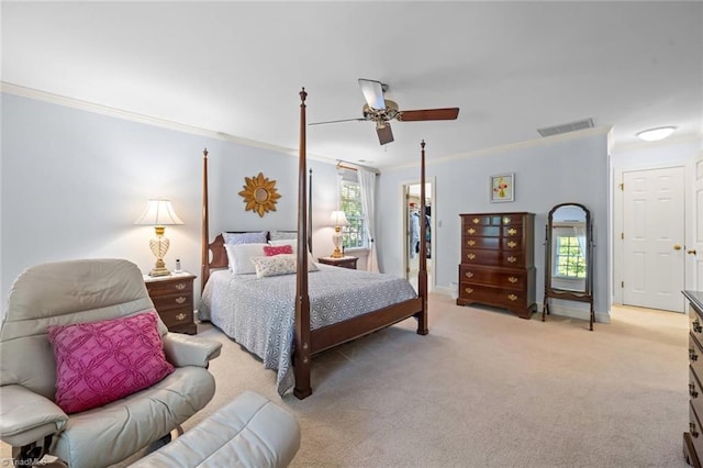 bedroom featuring ornamental molding, light carpet, ceiling fan, and visible vents