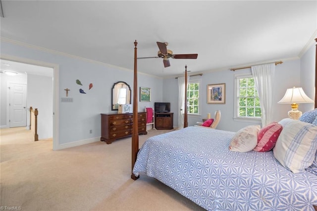 bedroom featuring crown molding, baseboards, ceiling fan, and light carpet